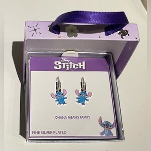Stitch dangle silver plated earrings. New in box.